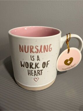 Nursing Is A Work Of Heart Ceramic Mug — Pink Interior
